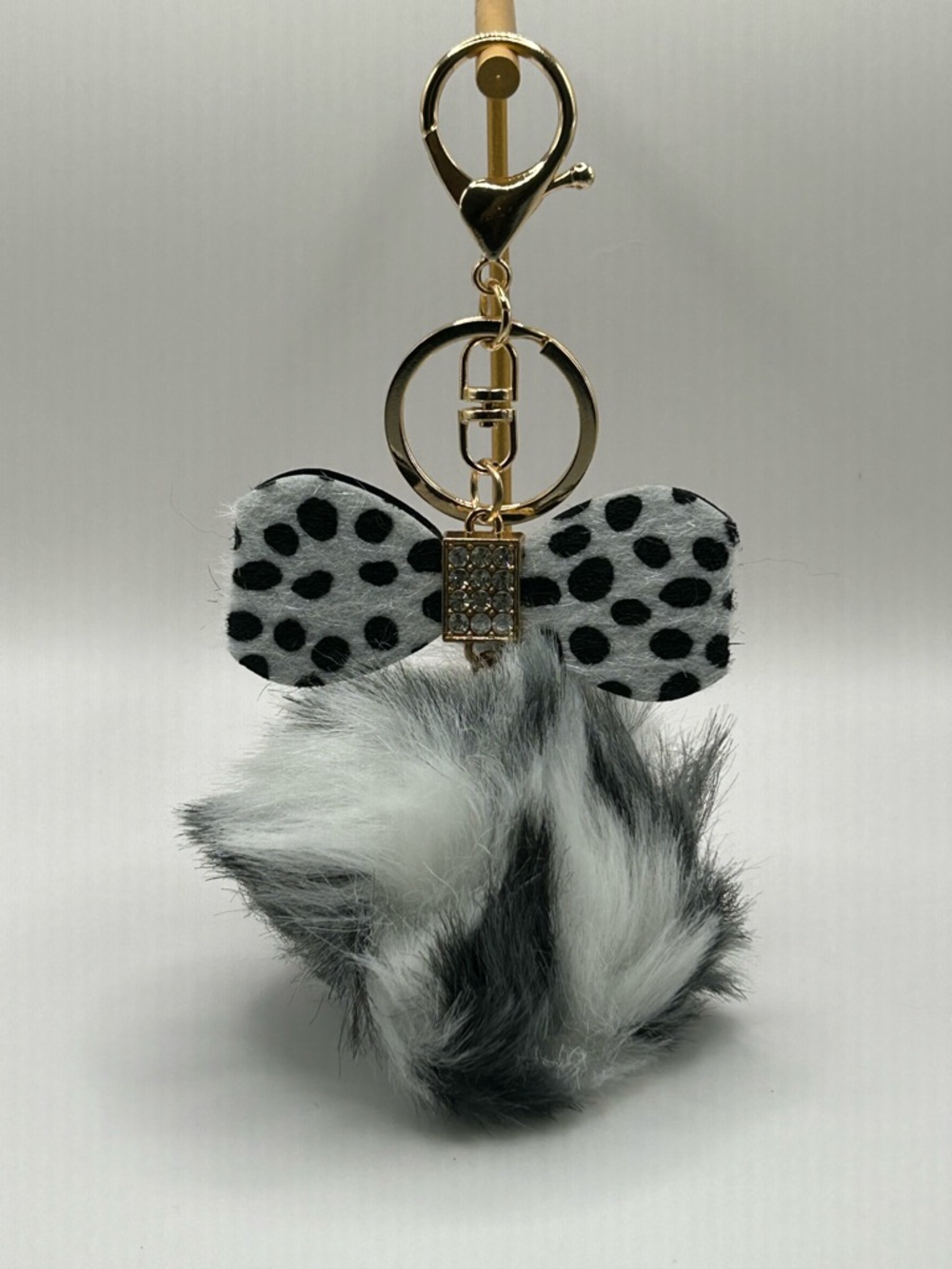 $15 or 2/$20 Faux Fur Pom Pom Keychain with Black & White Bow